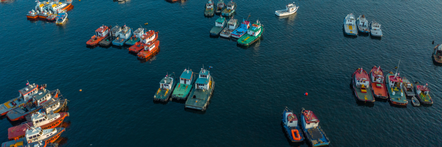 Aerial shot of fishing boats anchored on the ocean